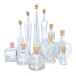 Variedad de botellas de cristal decorativas para envasar Esencia Andalusí